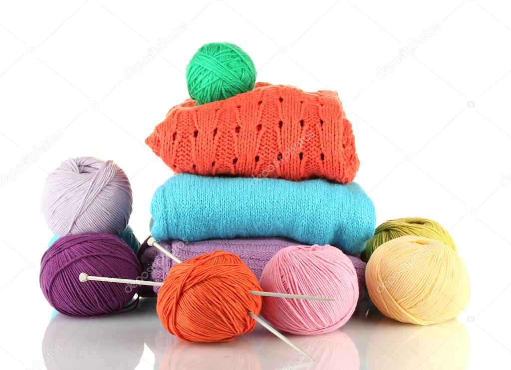 Sweaters and balls of wool isolated on white Stock Photo by ©belchonock 15316171