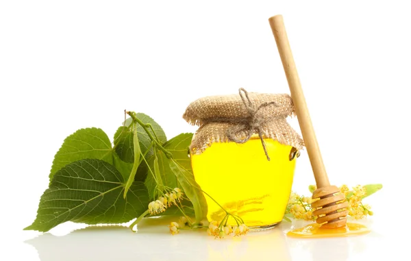 Jar with linden honey and flowers isolated on white — Stock Photo, Image