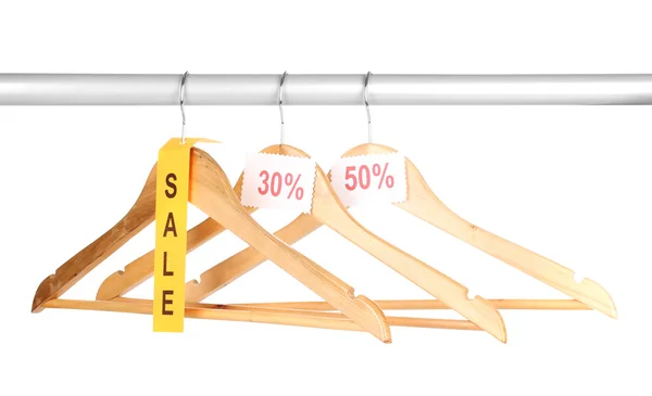 Wooden clothes hangers as sale symbol isolated on white — Stock Photo, Image