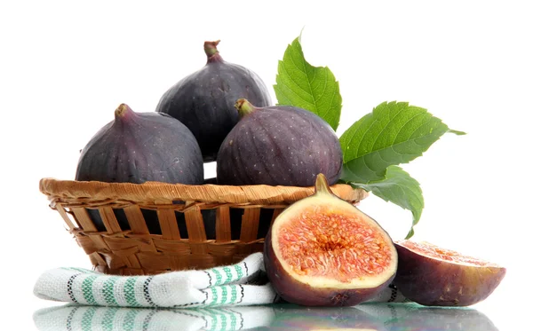 Ripe sweet figs with leaves in basket isolated on white — Stock Photo, Image