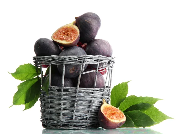 Ripe sweet figs with leaves in basket isolated on white — Stock Photo, Image