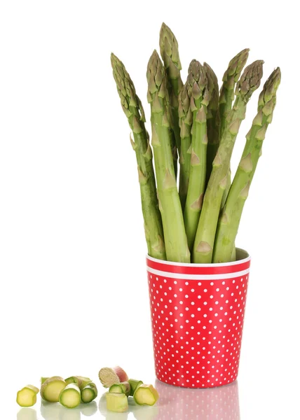 Fresh asparagus in colorful pot isolated on white — Stock Photo, Image