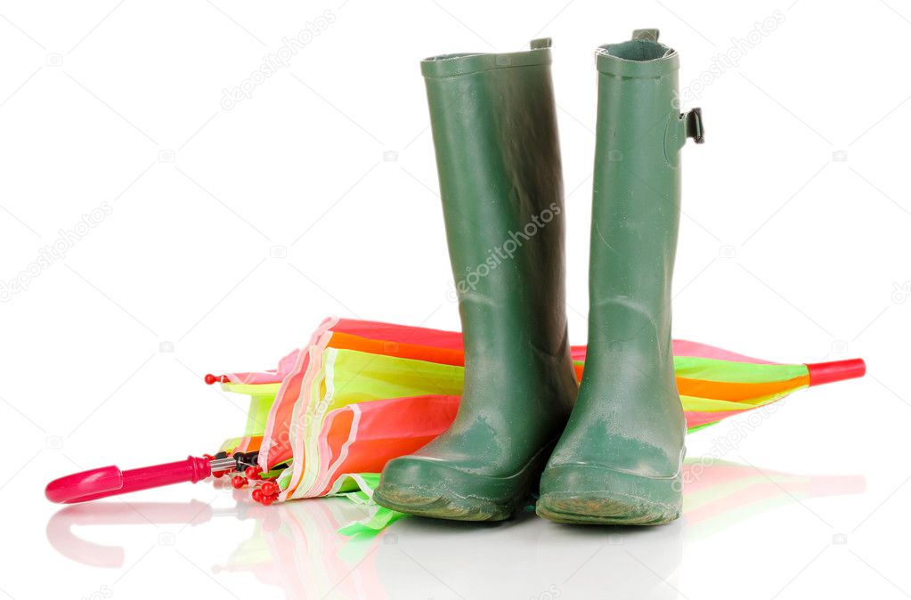 green gumboots and umbrella isolated on white