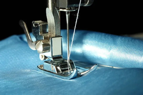 Sewing machine with blue cloth closeup — Stock Photo, Image