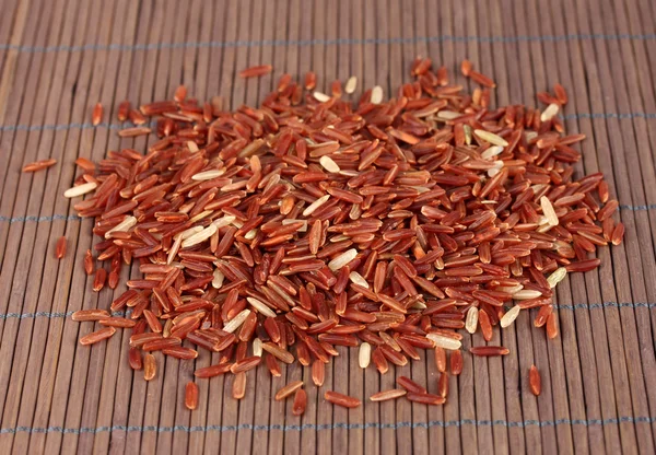 red rice on bamboo mat