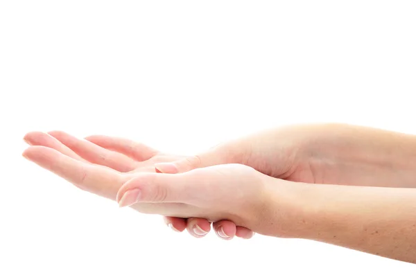 Una donna massaggiata a mano altra, isolata su bianco — Foto Stock