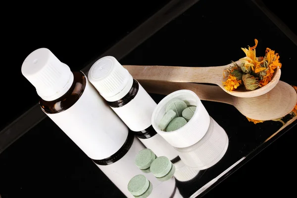 Alternative therapies on the tray on black background close-up — Stock Photo, Image