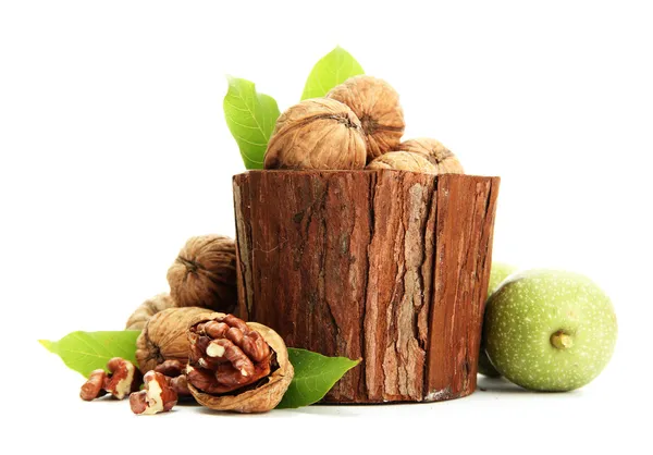 Walnuts with green leaves in woooden vase, isolated on white — Stock Photo, Image