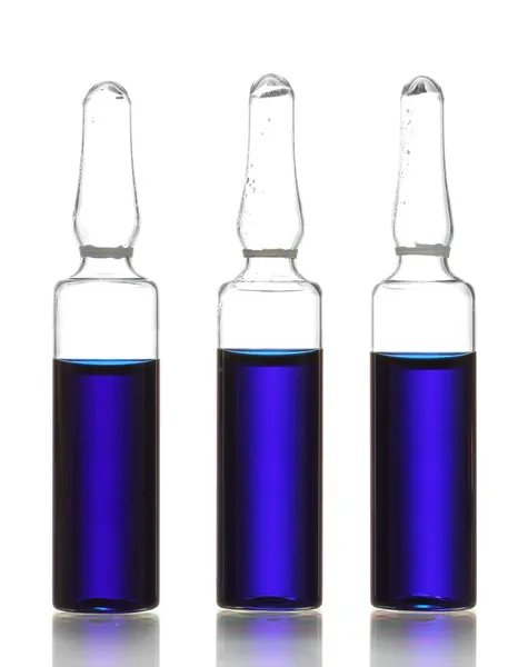 Ampollas médicas con líquido azul, aisladas en blanco —  Fotos de Stock