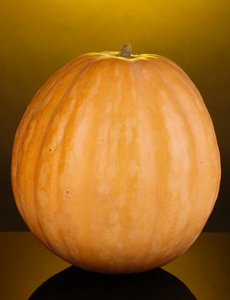 Ripe orange pumpkin on yellow background — Stock Photo, Image