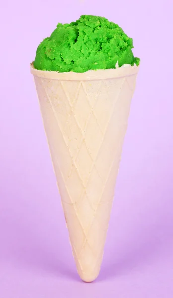 Kiwi ice cream with cone on lilac background — Stock Photo, Image