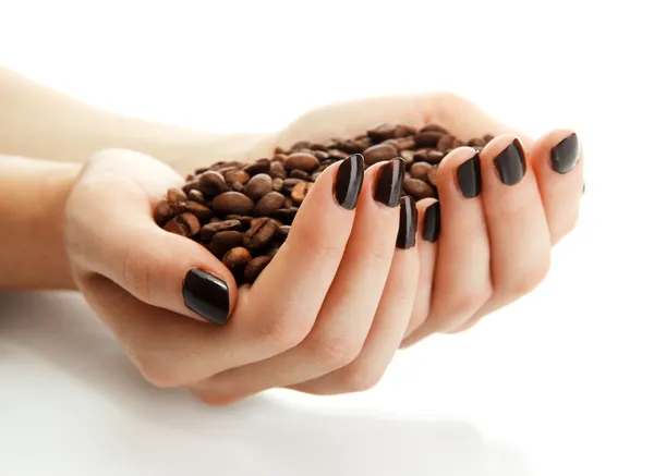 Mãos femininas com grãos de café, isoladas em branco — Fotografia de Stock