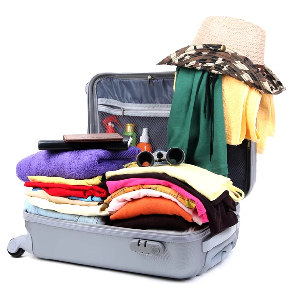 Open silver suitcase with clothing isolated on white — Stock Photo, Image