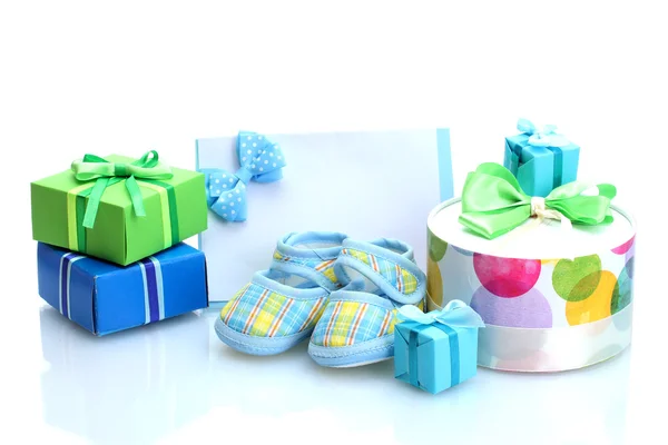 Beautiful gifts, baby's bootees, blank postcard and dummy isolated on white — Stock Photo, Image