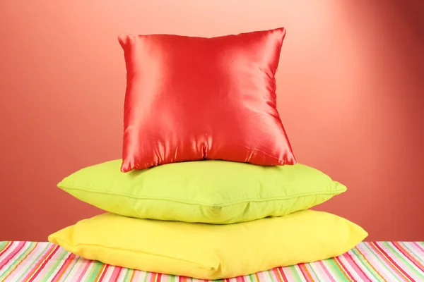 Pillows on red background — Stock Photo, Image