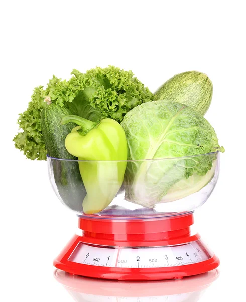 Fresh green vegetables in scales isolated on white — Stock Photo, Image