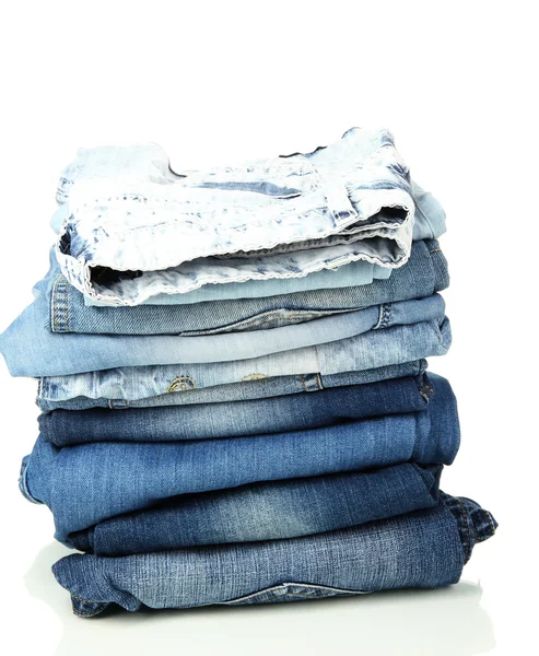 Lot of different blue jeans isolated on white — Stock Photo, Image