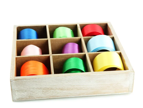 Bright silk ribbons in wooden box, isolated on white — Stock Photo, Image