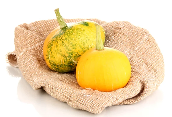 Two pumpkins on sackcloth isolated on white — Stock Photo, Image