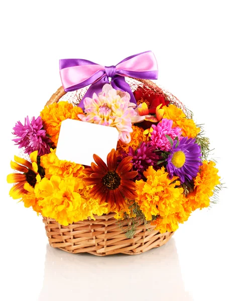 Beautiful bouquet of bright flowers in basket with paper note isolated on white — Stock Photo, Image