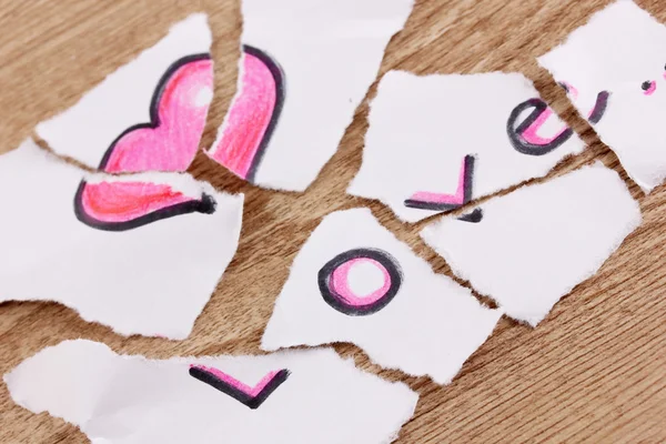 Torn paper with words Love close-up on wooden table — Stock Photo, Image