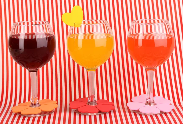 Colorful cocktails with bright decor for glasses on red background with stripes — Stock Photo, Image