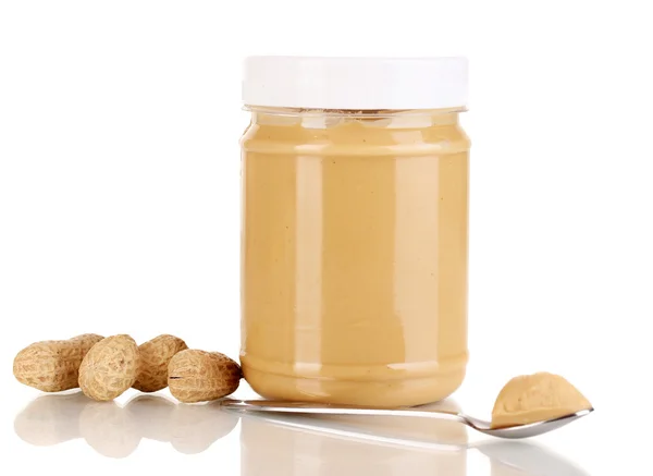 Delicious peanut butter in jar isolated on white — Stock Photo, Image