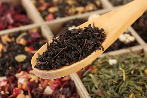 Assortment of dry tea in wooden box, close up — Stock Photo, Image