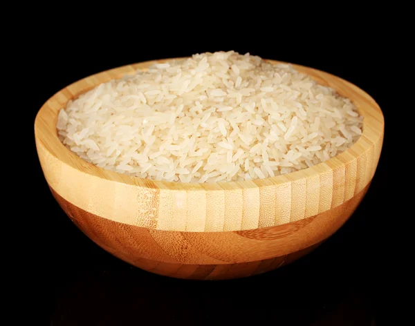 White polished rice in wooden bowl isolated on black — Stock Photo, Image
