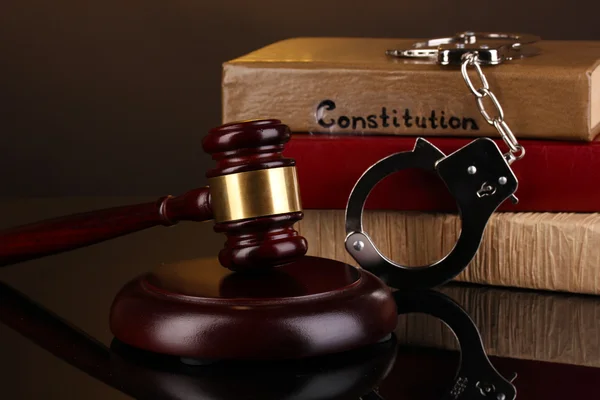 Gavel, handcuffs and books on law isolated on black — Stock Photo, Image