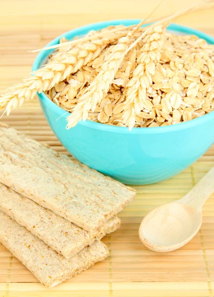 Blue bowl full of oat flakes — Stock Photo, Image