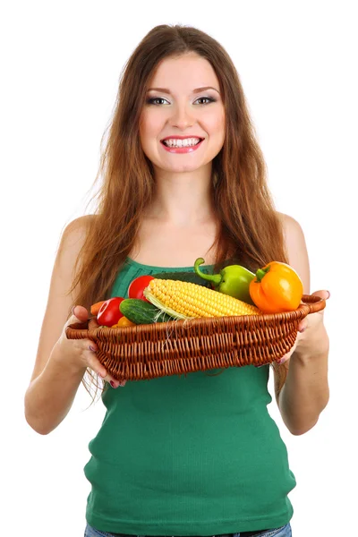 Mulher bonita com legumes em cesta de vime isolada em branco — Fotografia de Stock
