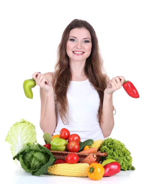 Belle femme avec des légumes sur la table isolé sur blanc — Photo