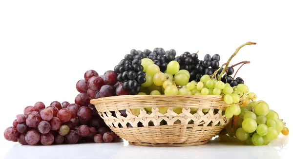 Assortment of ripe sweet grapes in basket, isolated on white — Stock Photo, Image