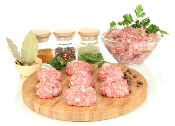 Raw meatballs with spices isolated on white — Stock Photo, Image