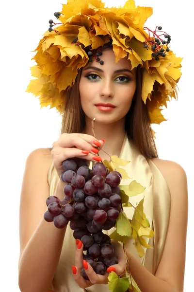 Beautiful young woman with yellow autumn wreath and grapes, isolated on white — Stock Photo, Image