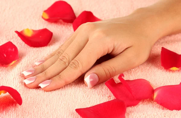 Woman's hand on pink terry towel, close-up Stock Photo