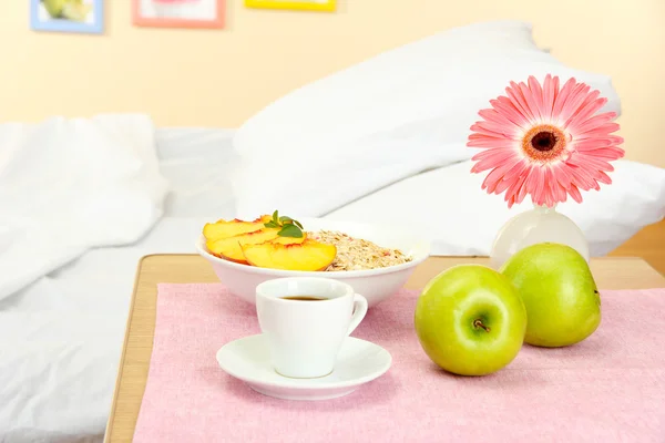 Light breakfast on the nightstand next to the bed — Stock Photo, Image