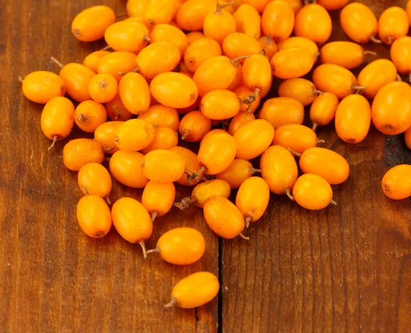 Sea buckthorn on wooden background close-up — Stock Photo, Image