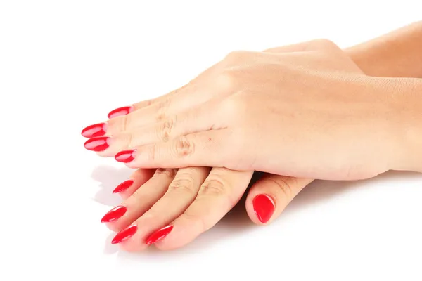 Beautiful female hands with red nails isolated on white — Stock Photo, Image