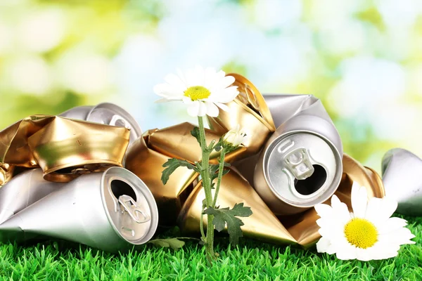 Garbage with growing flower. Environmental conservation concept — Stock Photo, Image