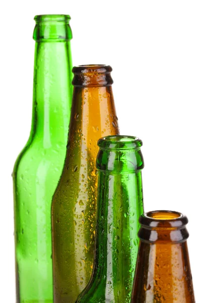 Colorate bottiglie di vetro vuote isolate su bianco — Foto Stock