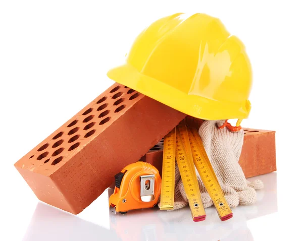 Helmet, roulette, bricks and gloves isolated on white — Stock Photo, Image