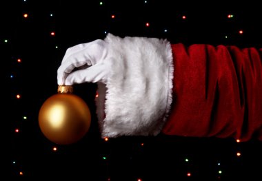 Noel Baba el Noel top parlak arka planda tutarak