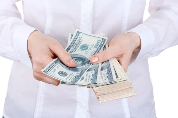 Amerikanische Dollars in einer Frauenhand auf weißem Hintergrund — Stockfoto