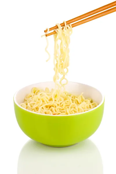 Chopsticks holding asian noodles isolated on white — Stock Photo, Image