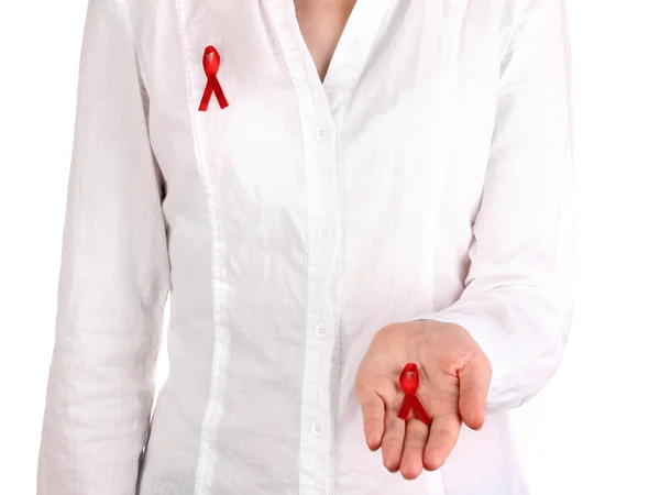 Woman with red ribbon in hands on isolated on white — Stock Photo, Image