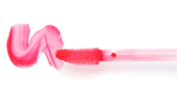 Beautiful lip gloss smear with brush, isolated on white — Stock Photo, Image