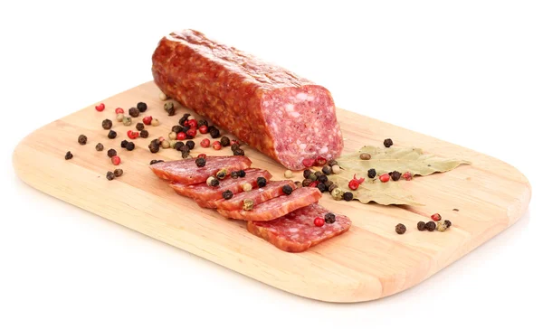 Tasty sausage on chopping board isolated on white — Stock Photo, Image