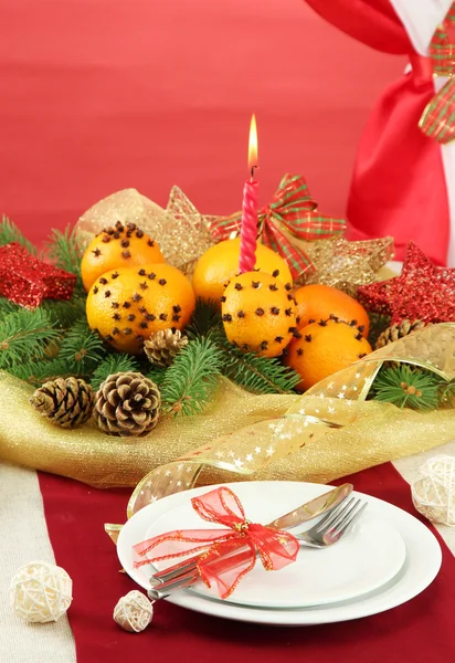 Beautiful christmas table setting with tangerines and fir tree, close up — Stock Photo, Image